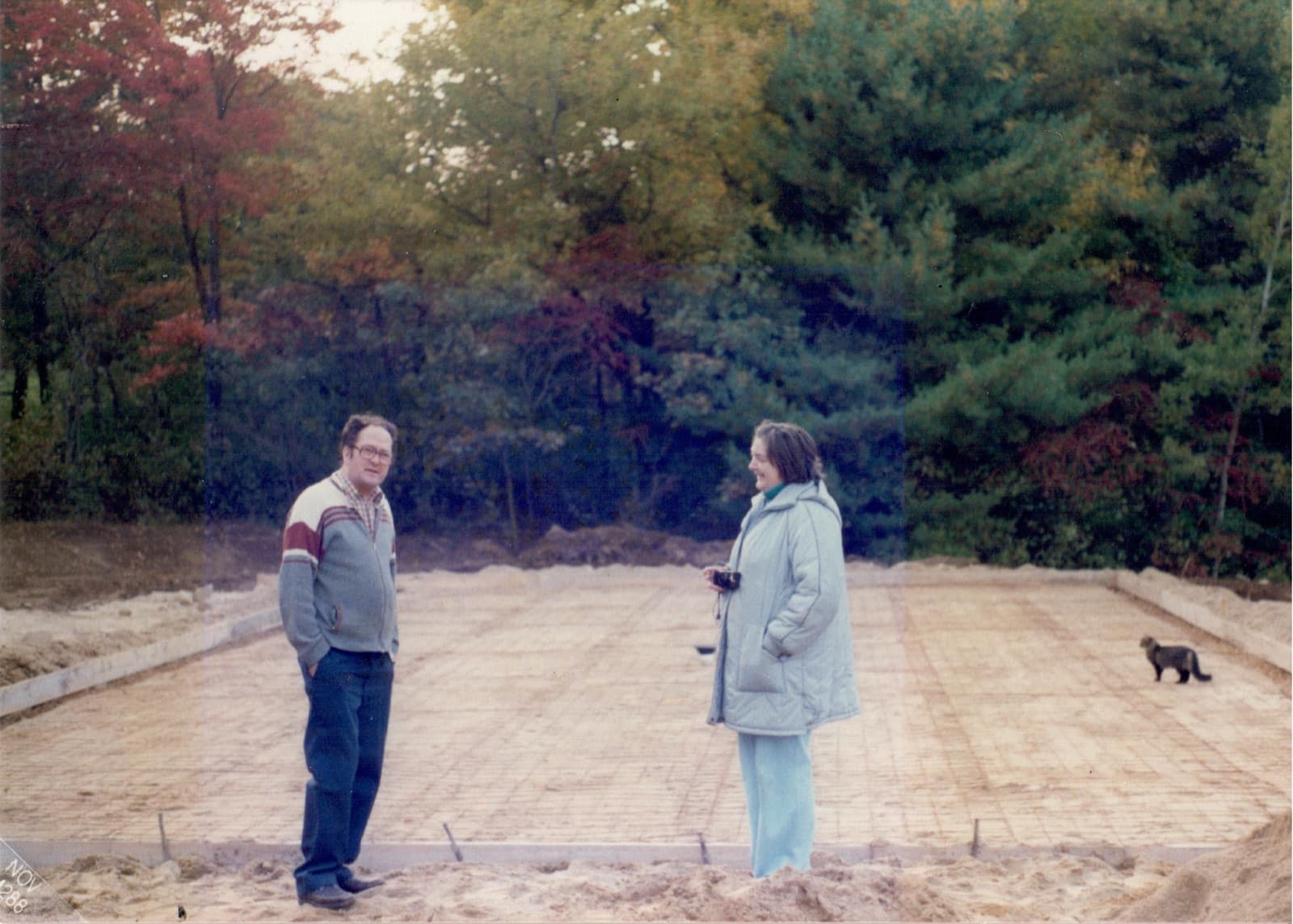 Donald Clark on the freshly poured slab of the new Clark Marine shop, November 1988.